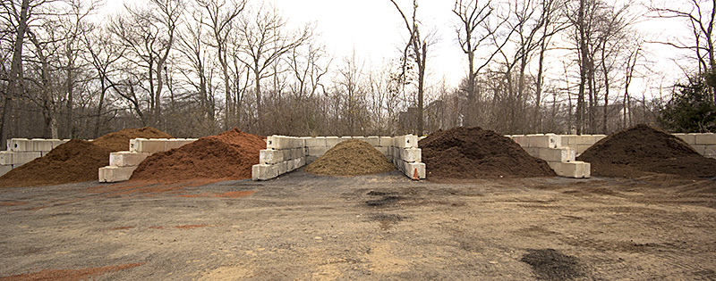 Photo of different piles o f compost as various stages of decomposition
